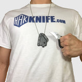 Holding Tiger Claw Knife and Necklace